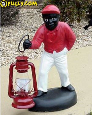 black statue holding a lantern